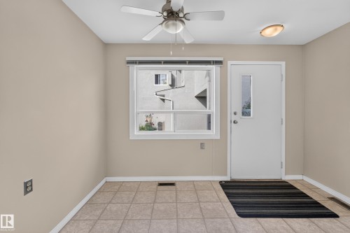 Tiled flooring, white trim, recessed window with blinds, ceiling fan, and flush-mount ceiling light fixture - 17749 95 Street Nw, Edmonton, AB 