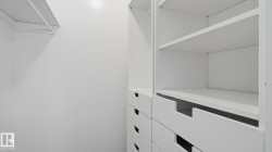 Built-in closet organization system featuring adjustable shelving and integrated drawers - 