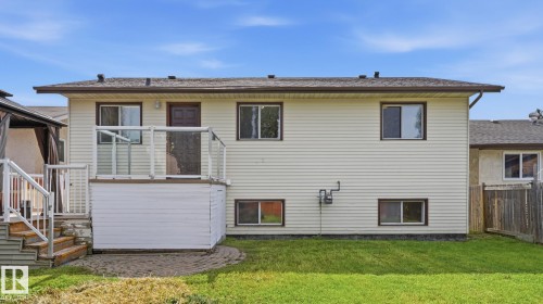 Two-story exterior with light-colored siding - 12208 146 Avenue Nw, Edmonton, AB 