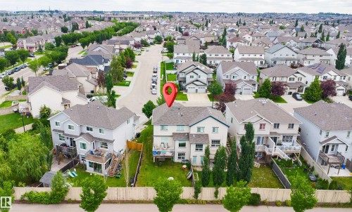 Aerial perspective showcasing a residential property with a multi-level deck and a fenced backyard - 1608 65 Street Sw, Edmonton, AB - Outdoor