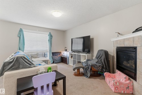 1608 65 Street Sw, Edmonton, AB - Indoor Photo Showing Living Room With Fireplace