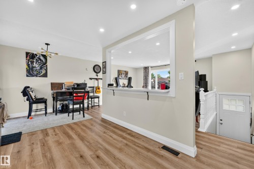 Wood-finish flooring throughout, recessed lighting, and crown molding - 2412 80 Street Nw, Edmonton, AB 