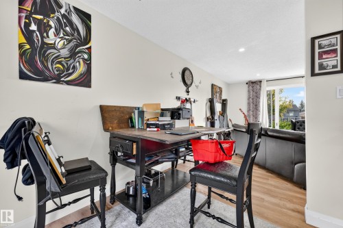 Light-toned walls with recessed lighting throughout - 2412 80 Street Nw, Edmonton, AB 