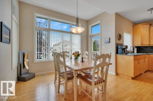 with large windows and door opening onto the deck - 739 Haliburton Crescent Nw, Edmonton, AB 