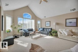 Vaulted ceiling with an arched window and vertical blinds - 