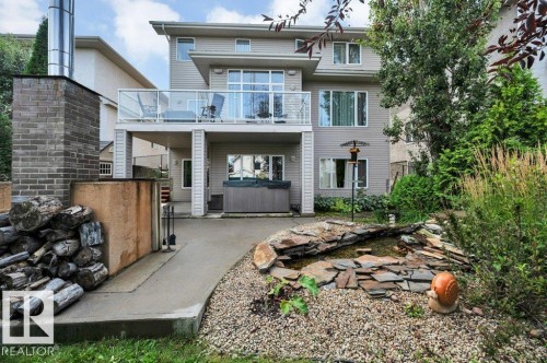 Two-story exterior with a deck, walk-out basement, patio and HOT TUB - 739 Haliburton Crescent Nw, Edmonton, AB 