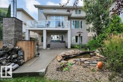 Two-story exterior with a deck, walk-out basement, patio and HOT TUB - 