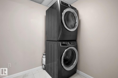 Stacked black laundry units - #105 160 Magrath Rd Nw, Edmonton, AB 