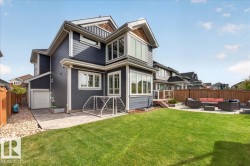 Oversized triple garage could fit 4-5 vehicles and convenient overhead door to bring kayaks & sup to the lake - 