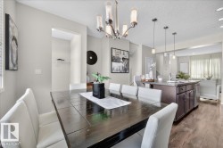 Open-concept interior with wood-finish flooring - 