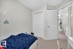 Light-colored wall finishes, contrasting trim, panel-style interior doors, and neutral carpet flooring - 