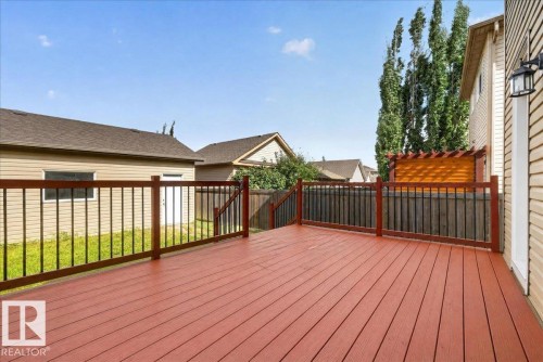 Expansive wooden deck with a red-toned finish - 2046 Chalmers Way Sw, Edmonton, AB 