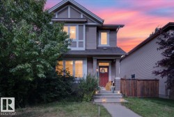 Two-story residence featuring horizontal siding and contrasting trim - 