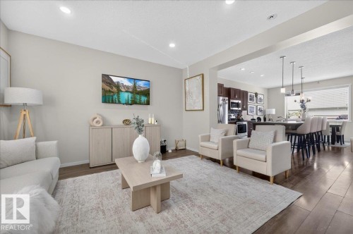 Recessed lighting, wood-finish flooring, and an open-concept layout - 2046 Chalmers Way Sw, Edmonton, AB 