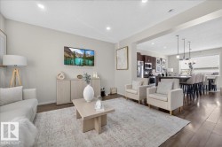 Recessed lighting, wood-finish flooring, and an open-concept layout - 