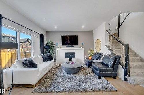 1399 Watt Drive Sw, Edmonton, AB - Indoor Photo Showing Living Room With Fireplace