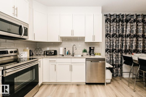 1399 Watt Drive Sw, Edmonton, AB - Indoor Photo Showing Kitchen With Double Sink