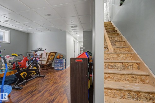 Finished lower level featuring recessed lighting and wood-finish flooring - 3343 Weidle Way Sw, Edmonton, AB 