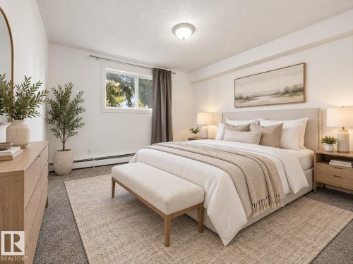 Recessed lighting, window with exterior exposure, light-toned walls, and carpet flooring - #119 3611 145 Av Nw, Edmonton, AB 