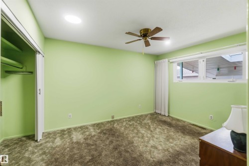 Recessed ceiling light, ceiling fan, skylight window, double-pane windows, and a built-in closet with sliding doors - 9311 68 Street Nw, Edmonton, AB 