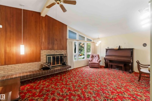 Vaulted ceiling with wood-paneled accent wall - 9311 68 Street Nw, Edmonton, AB 