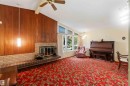Vaulted ceiling with wood-paneled accent wall - 9311 68 Street Nw, Edmonton, AB 