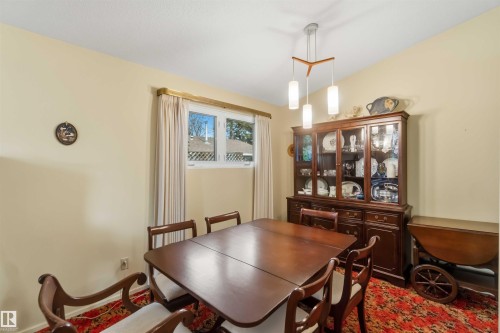 Recessed lighting, sloped ceiling, and window with curtains - 9311 68 Street Nw, Edmonton, AB 