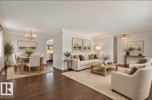 Dark wood-finish flooring, white crown molding, recessed archway, and a multi-arm chandelier in the dining area - 7304 98A Avenue Nw, Edmonton, AB 