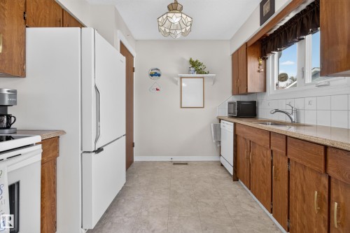 Quartz counters and lots of cabinetry - 14546 19 Street Nw, Edmonton, AB 