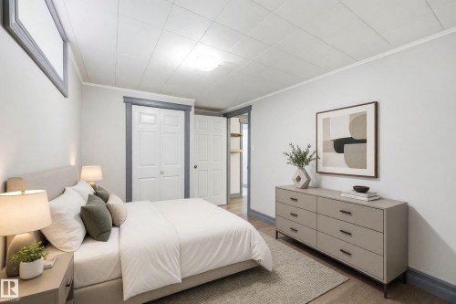 Recessed window, drop ceiling, wood-finish flooring, white paneled doors, and painted trim - 3523 106 Street Nw, Edmonton, AB 