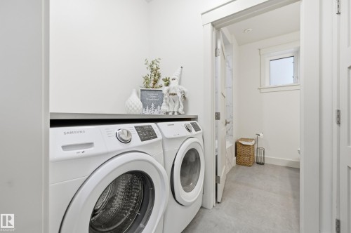 Dedicated laundry area featuring a countertop surface - 1961 Adamson Terrace Sw, Edmonton, AB 