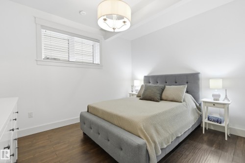 Wood-finish flooring, recessed lighting, window with blinds, drum pendant lighting fixture, white walls - 1961 Adamson Terrace Sw, Edmonton, AB 