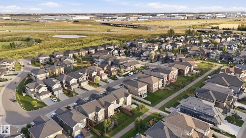 Residential development featuring a variety of architectural styles, paved streets, and green spaces - 1961 Adamson Terrace Sw, Edmonton, AB 