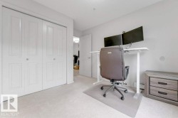 Plush carpet flooring, white bi-fold closet doors, and recessed ceiling lighting - 