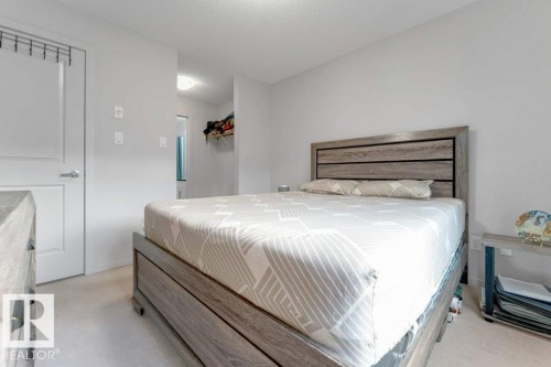 White interior door with brushed nickel hardware - #224 390 Windermere Rd Nw, Edmonton, AB 