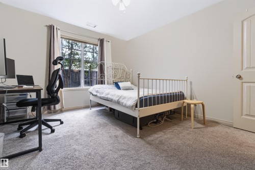 Neutral-toned walls complement the light-colored carpet flooring - #155 2096 Blackmud Creek Dr Sw, Edmonton, AB 
