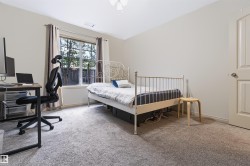 Neutral-toned walls complement the light-colored carpet flooring - 