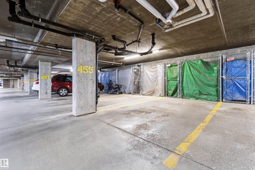 Concrete flooring throughout, exposed concrete ceiling, and exposed utility piping - #155 2096 Blackmud Creek Dr Sw, Edmonton, AB 