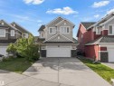 Two-story exterior with light gray siding and dark gray shingle roofing - 8515 19 Avenue Sw, Edmonton, AB 