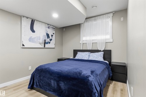 Recessed lighting, wood-finish flooring, and light-toned wall finishes - 8515 19 Avenue Sw, Edmonton, AB 