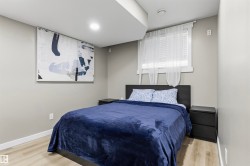 Recessed lighting, wood-finish flooring, and light-toned wall finishes - 