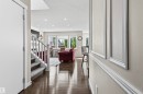 Hardwood-finish flooring, recessed lighting, wainscoting, and white trim accents - 8515 19 Avenue Sw, Edmonton, AB 