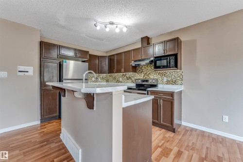7743 8 Avenue Sw, Edmonton, AB - Indoor Photo Showing Kitchen With Upgraded Kitchen