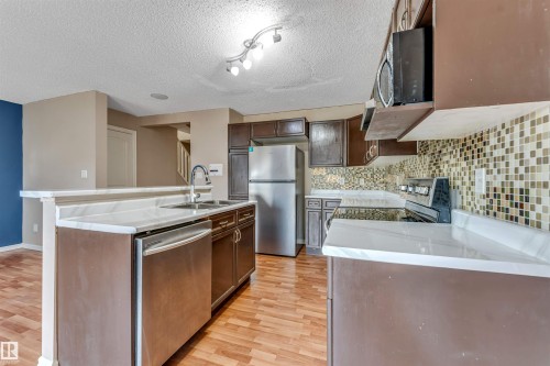 7743 8 Avenue Sw, Edmonton, AB - Indoor Photo Showing Kitchen With Double Sink