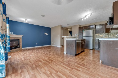 7743 8 Avenue Sw, Edmonton, AB - Indoor Photo Showing Kitchen With Fireplace