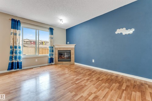 7743 8 Avenue Sw, Edmonton, AB - Indoor Photo Showing Living Room With Fireplace