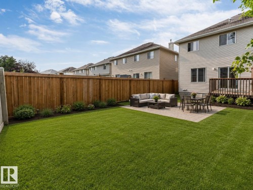 AI-ENHANCED IMAGE — FOR ILLUSTRATION PURPOSES ONLY - 7743 8 Avenue Sw, Edmonton, AB - Outdoor With Backyard