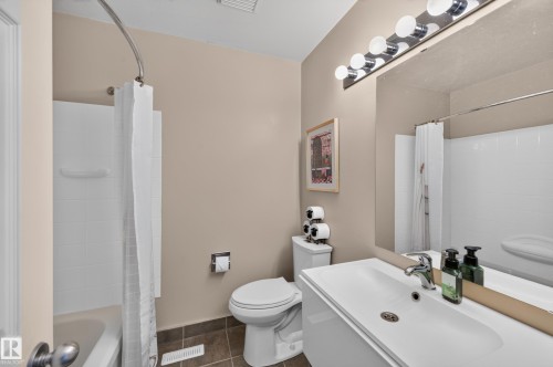 White ceramic tile shower surround with integrated tub - 7704 13 Avenue Nw, Edmonton, AB 
