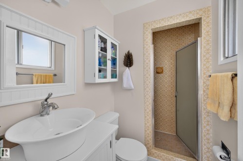 White vanity with vessel sink and chrome faucet - 7704 13 Avenue Nw, Edmonton, AB 