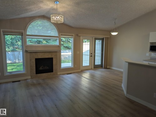 211 Youville Drive Nw, Edmonton, AB - Indoor Photo Showing Living Room With Fireplace
